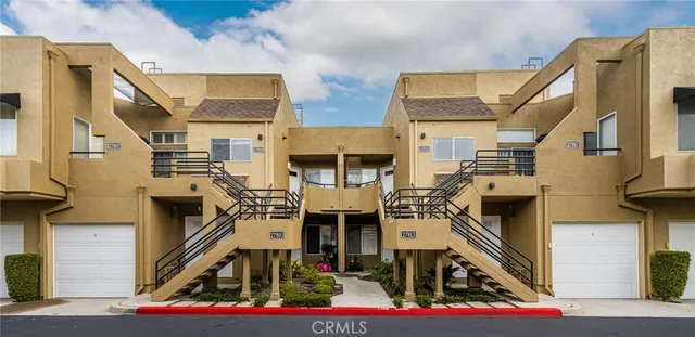 a front view of a building with many windows