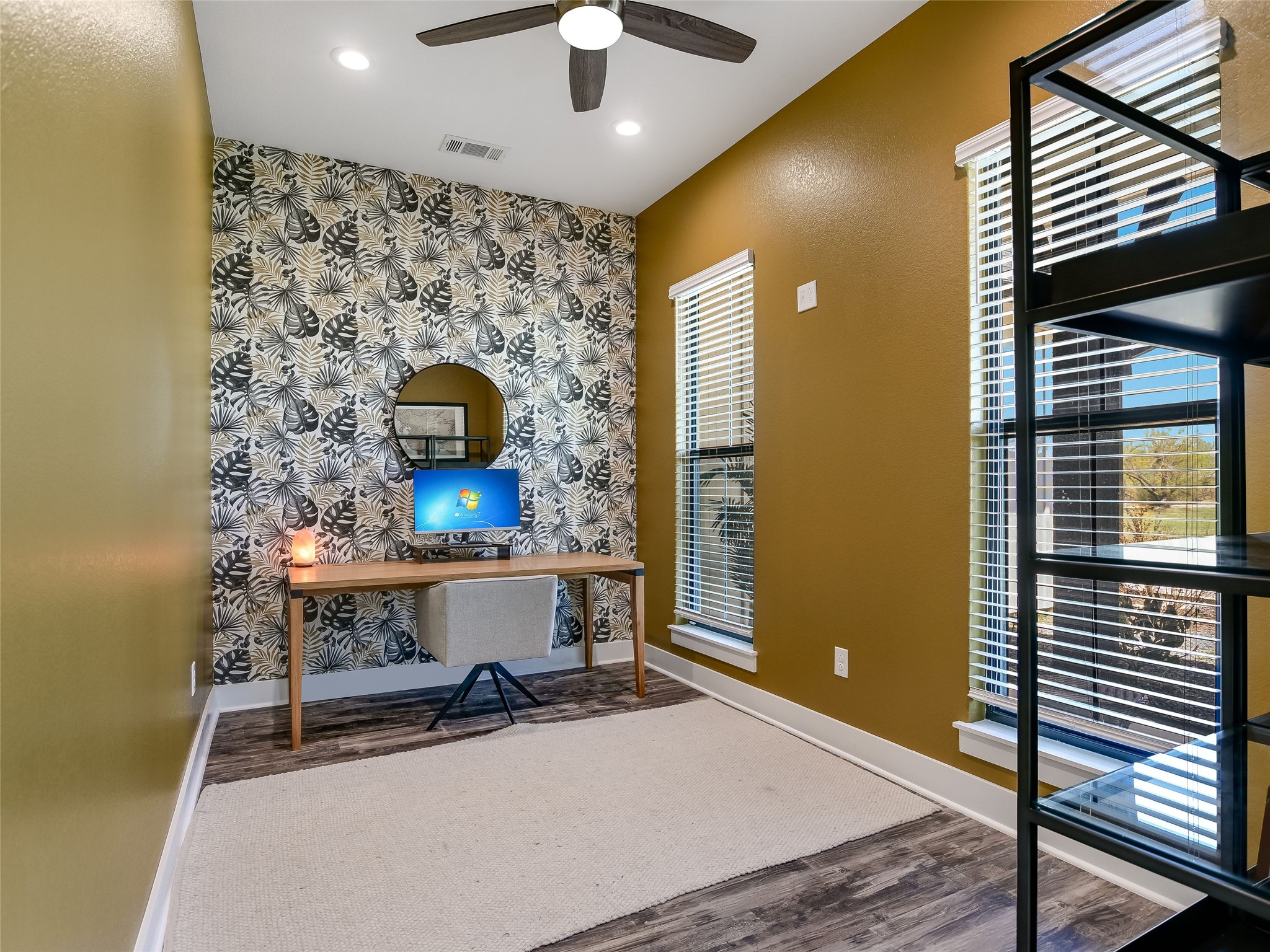 19819 Lockwood Road Manor, TX 78653 - Photo 6 of 29 This stylish flex space off the entry features bold accent wallpaper, rich natural light, and the flexibility to serve as a home office or creative studio.