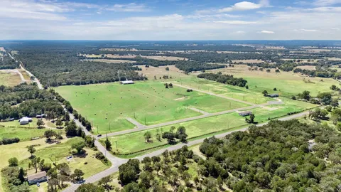 a view of a green field with clear sky