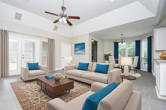 a living room with furniture and a large window