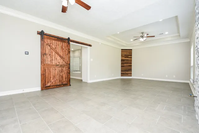 a view of an empty room with a window