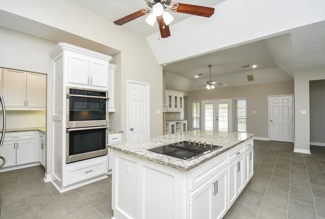 a kitchen with a stove and a microwave