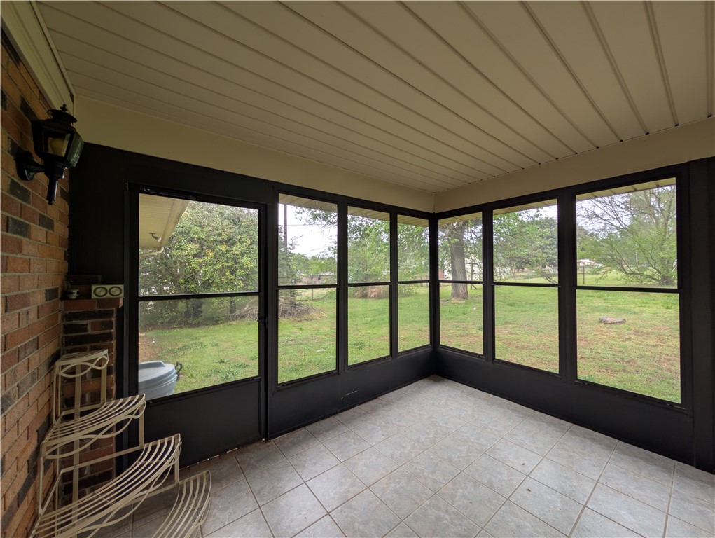 1000 Hickory Lane Anderson, SC 29624 - Photo 31 of 37 This bright sunroom offers serene outdoor views, perfect for peaceful mornings or relaxing evenings.