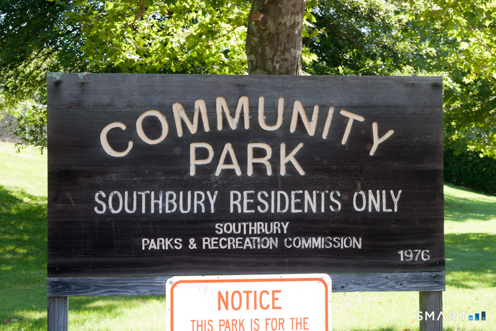 165 Community House Road Southbury, CT 06488 - Photo 26 of 29 a street sign sitting on a wooden wall
