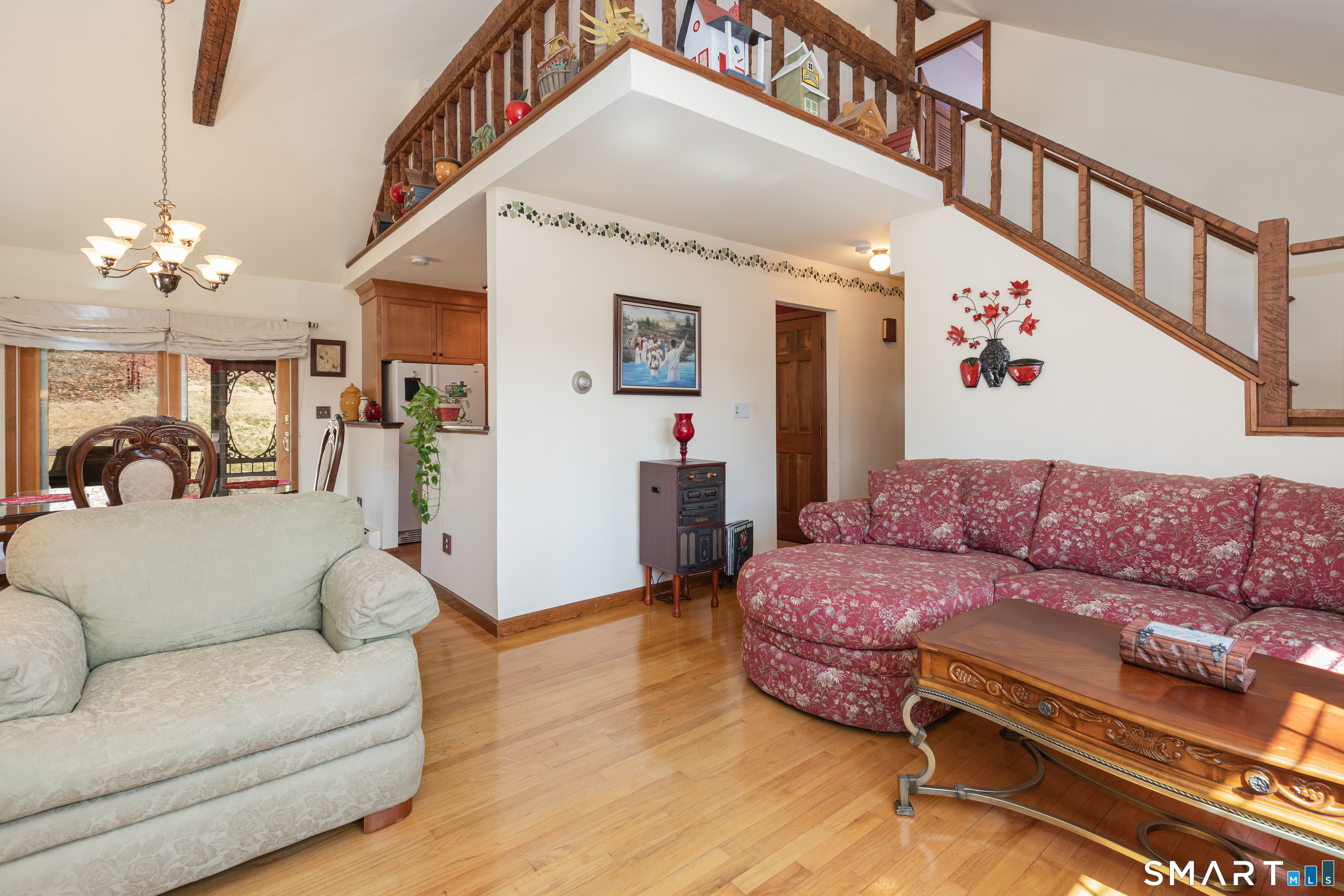 165 Community House Road Southbury, CT 06488 - Photo 3 of 29 a living room with furniture and a chandelier