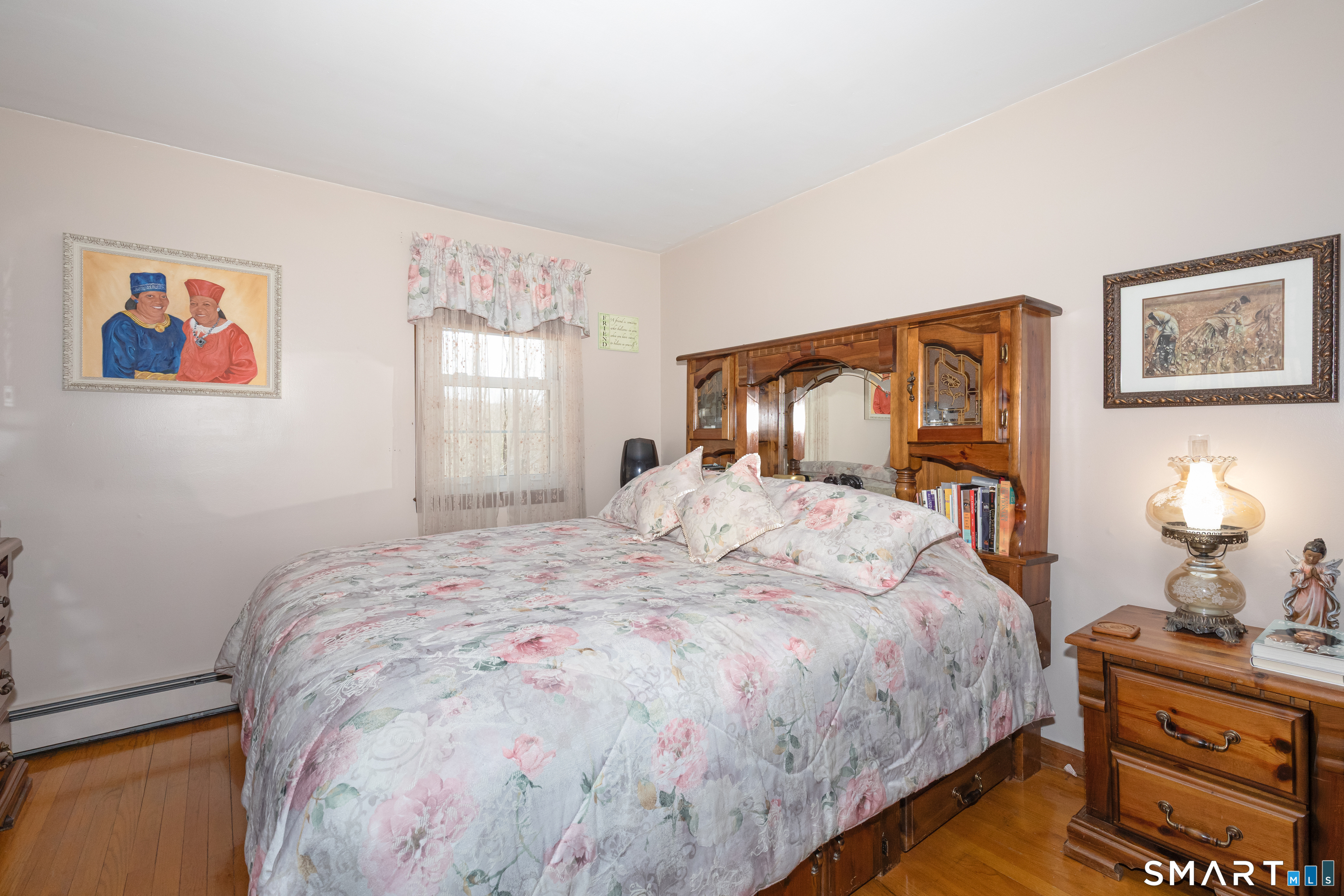 165 Community House Road Southbury, CT 06488 - Photo 4 of 29 a bedroom with a large bed and a dresser