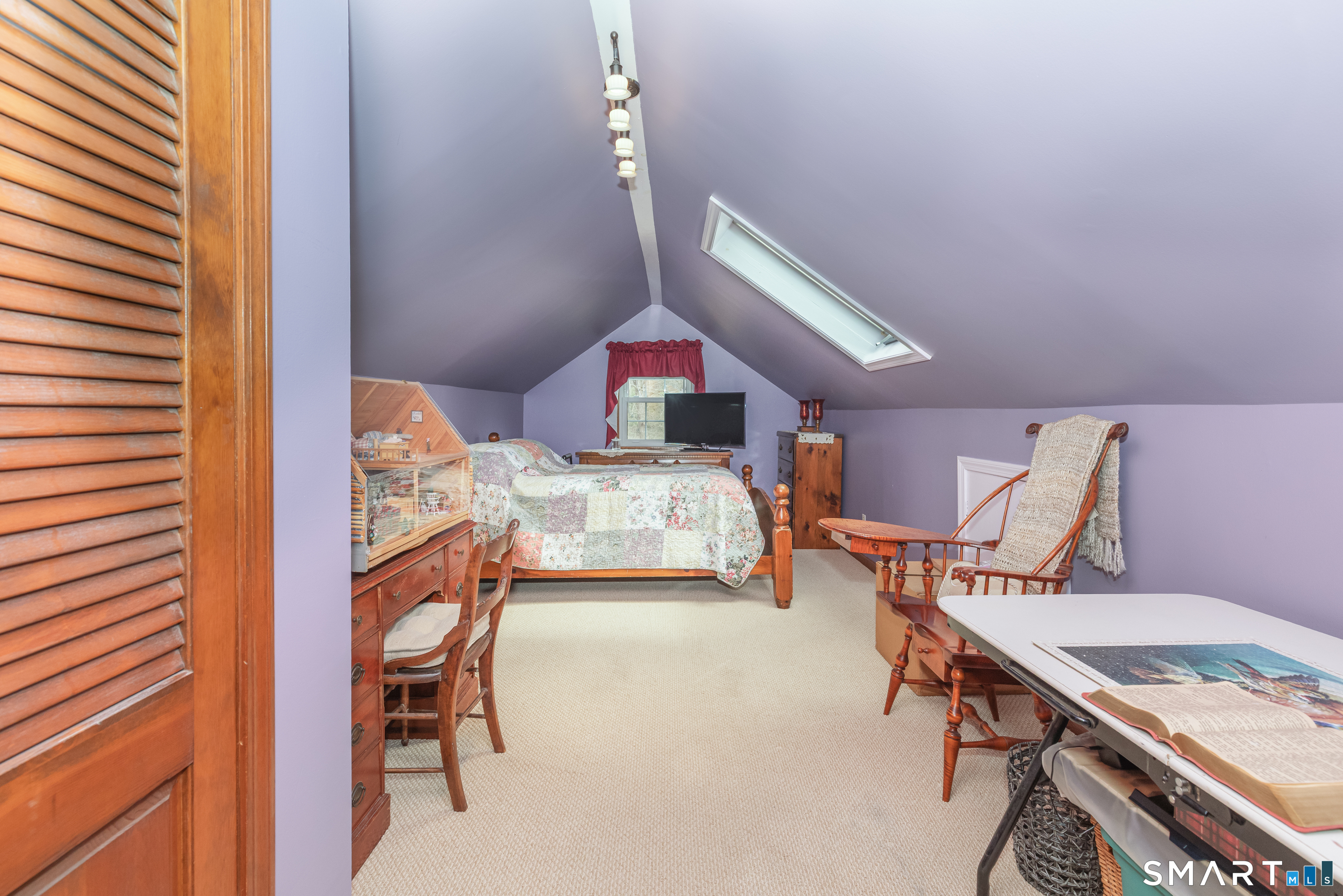 165 Community House Road Southbury, CT 06488 - Photo 9 of 29 a bedroom with a bed and a table in it