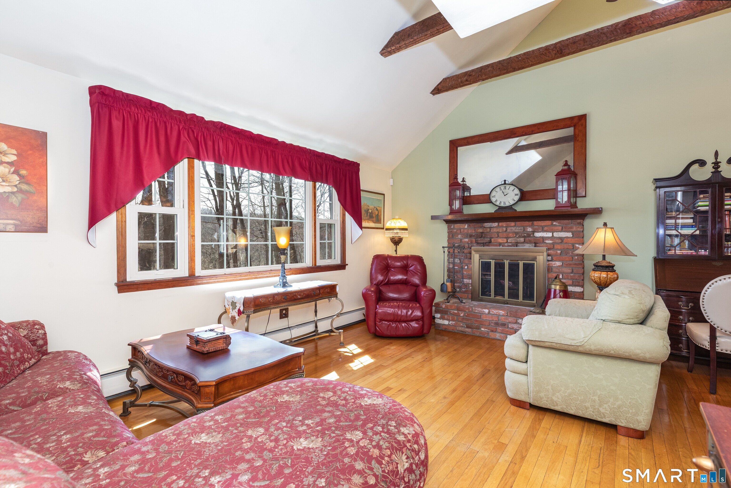 165 Community House Road Southbury, CT 06488 - Photo 10 of 29 a living room with fireplace furniture and a floor to ceiling window