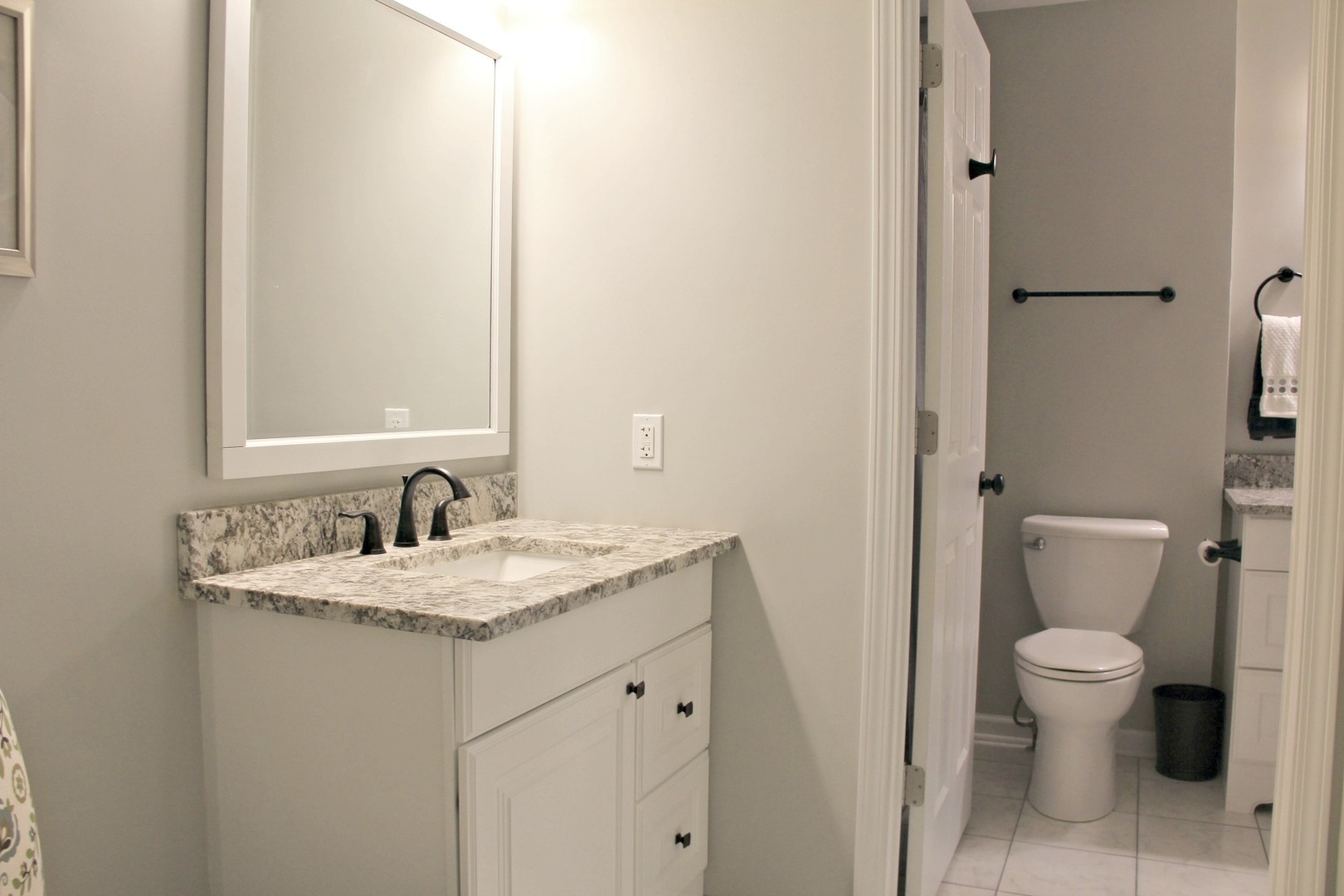 1316 Giese Road Batavia, IL 60510 - Photo 13 of 28 a bathroom with a granite countertop sink toilet and mirror