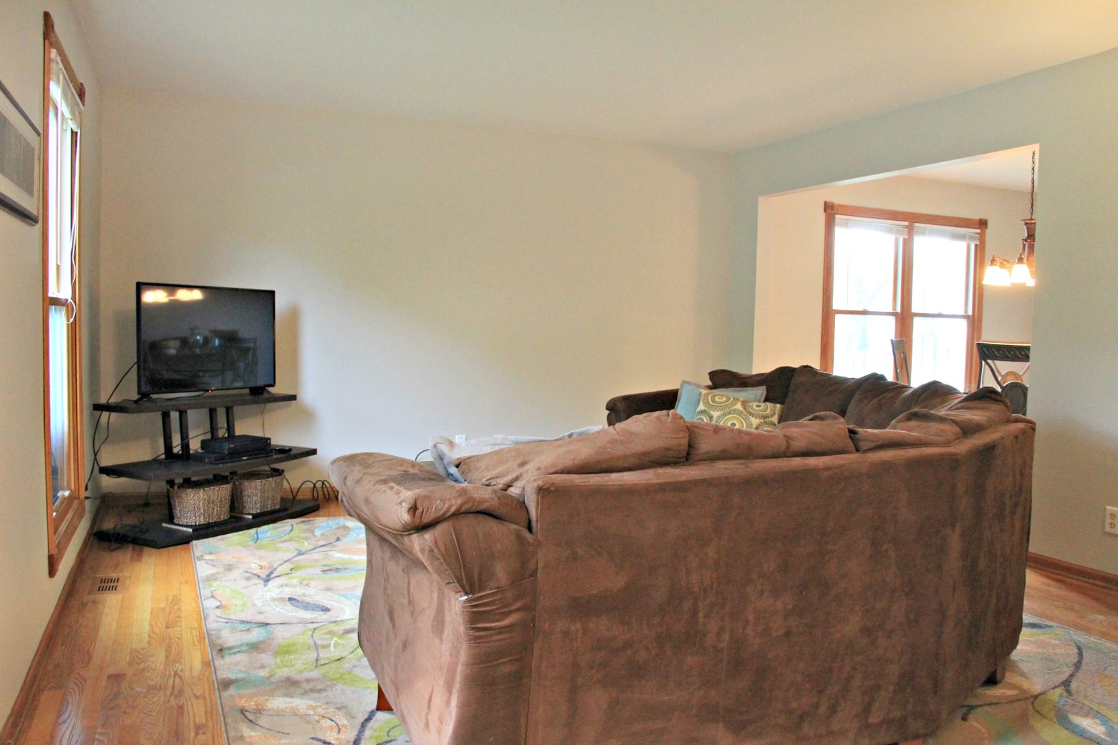 1316 Giese Road Batavia, IL 60510 - Photo 3 of 28 a bed sitting in a bedroom next to a window with tv