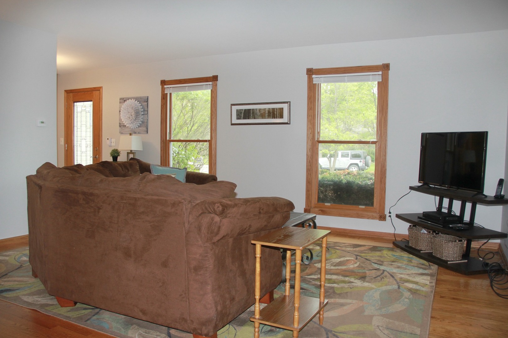 1316 Giese Road Batavia, IL 60510 - Photo 5 of 28 a living room with furniture and a flat screen tv