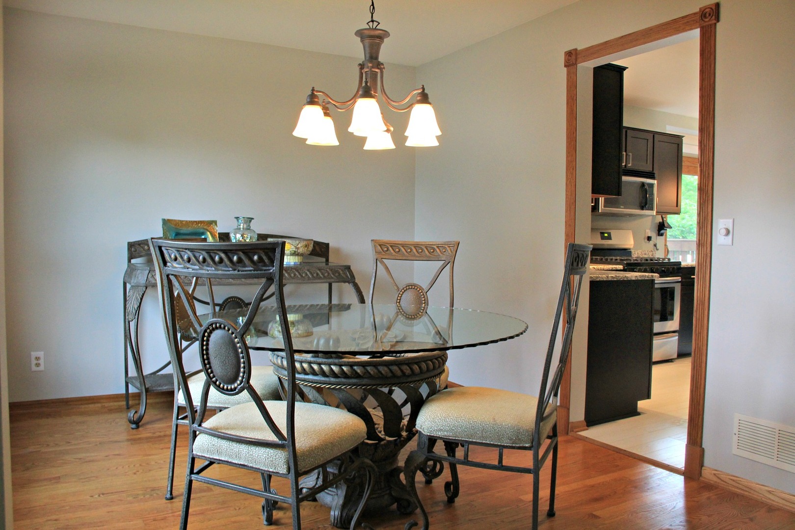 1316 Giese Road Batavia, IL 60510 - Photo 6 of 28 a view of a dining room with furniture and wooden floor