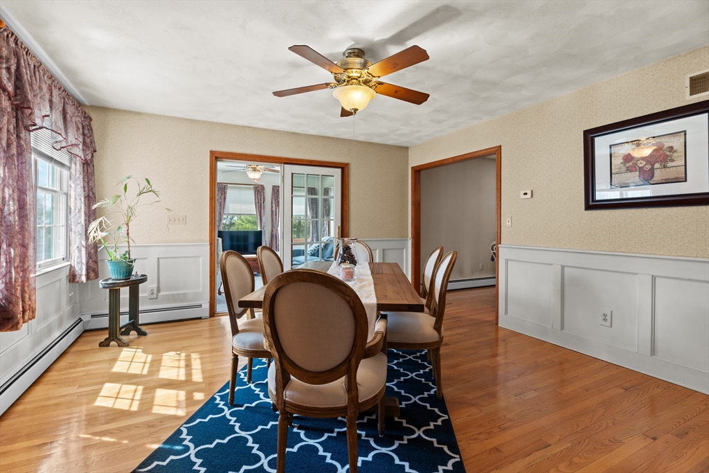 36 High Street Freetown, MA 02702 - Photo 14 of 42 a dining room with chandelier fan and wooden floor