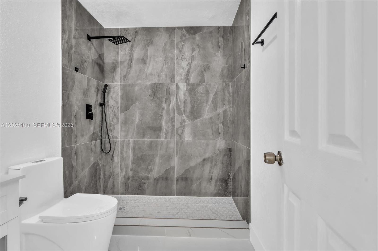 11790 Southwest 34th Street Miami, FL 33175 - Photo 43 of 56 a bathroom with a toilet and a shower