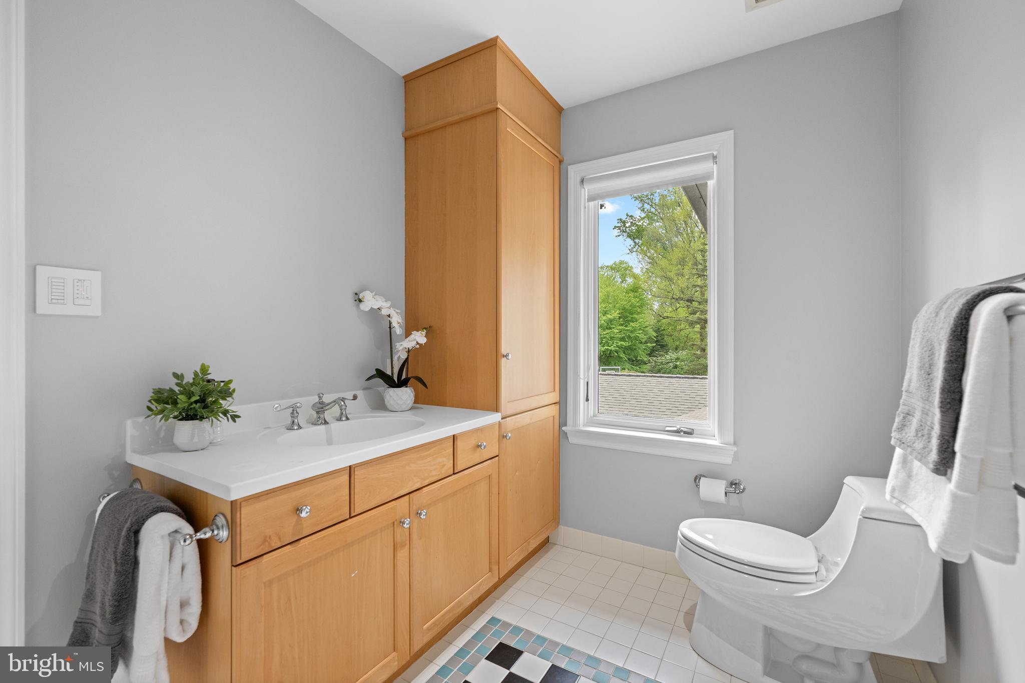 850 Lesley Road Villanova, PA 19085 - Photo 31 of 37 a bathroom with a granite countertop sink mirror vanity and toilet
