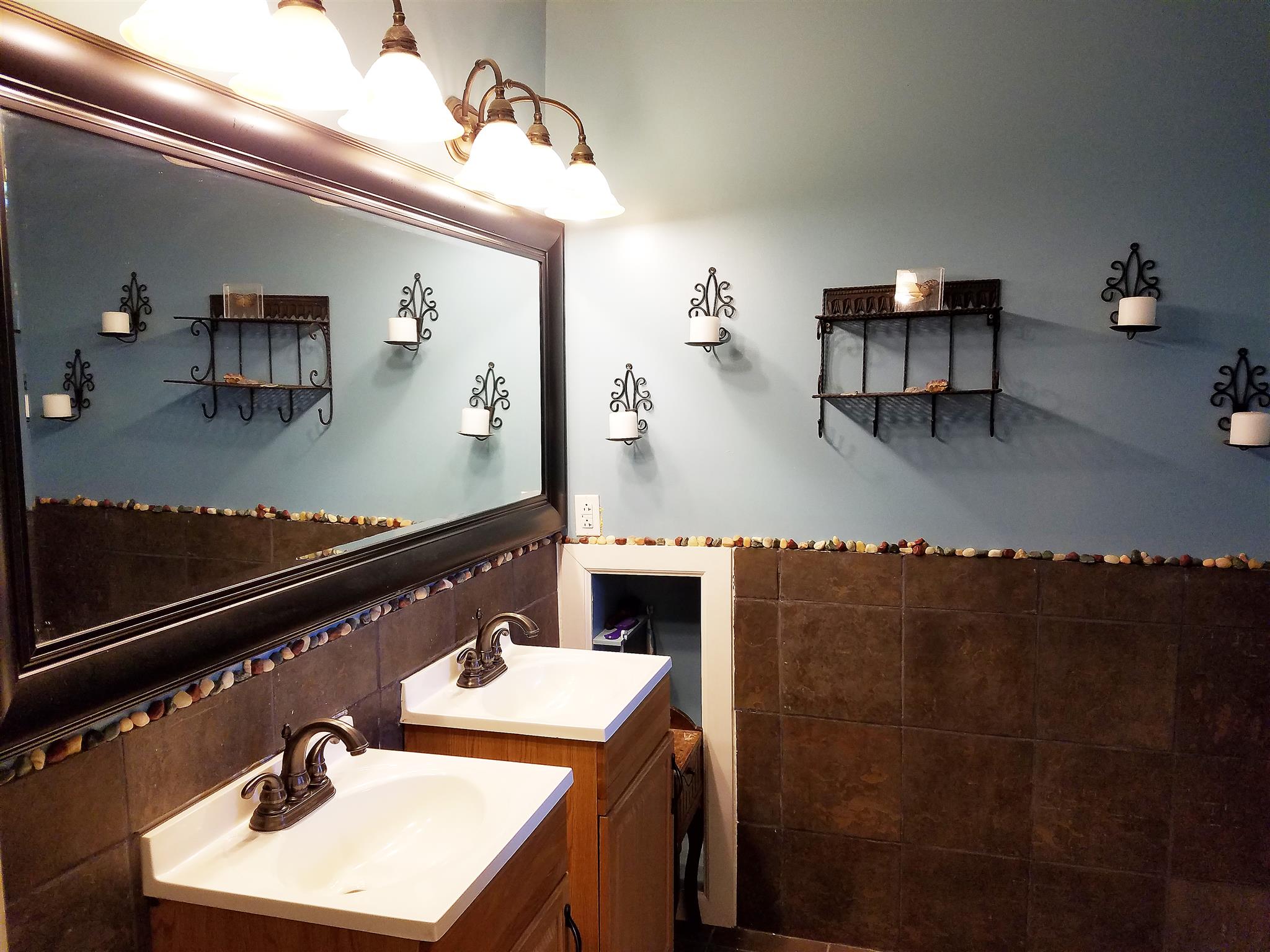606 Larkin Springs Road Madison, TN 37115 - Photo 11 of 20 a bathroom with a sink vanity and a mirror
