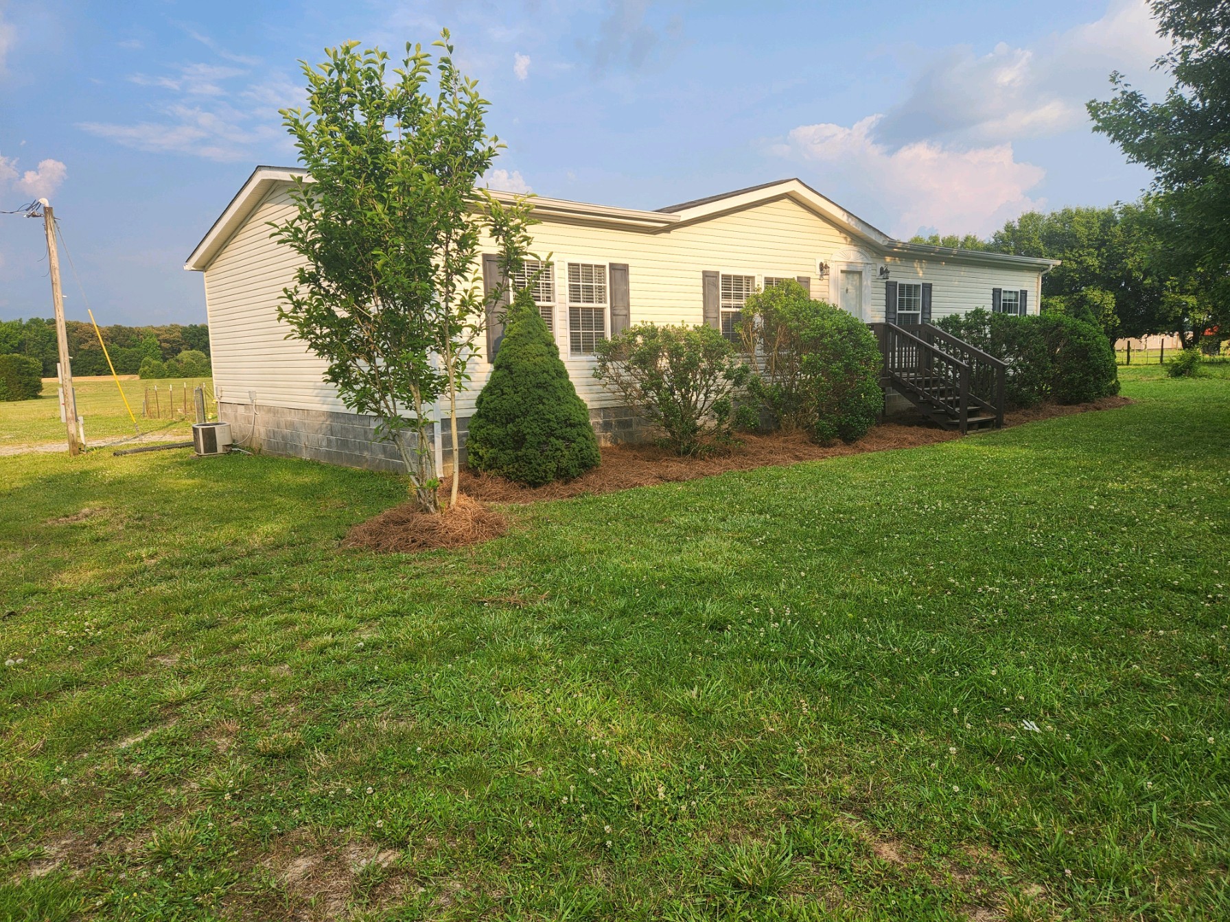 1056 Caney Branch Road Morrison, TN 37357 - Photo 1 of 12 a front view of a house with a yard
