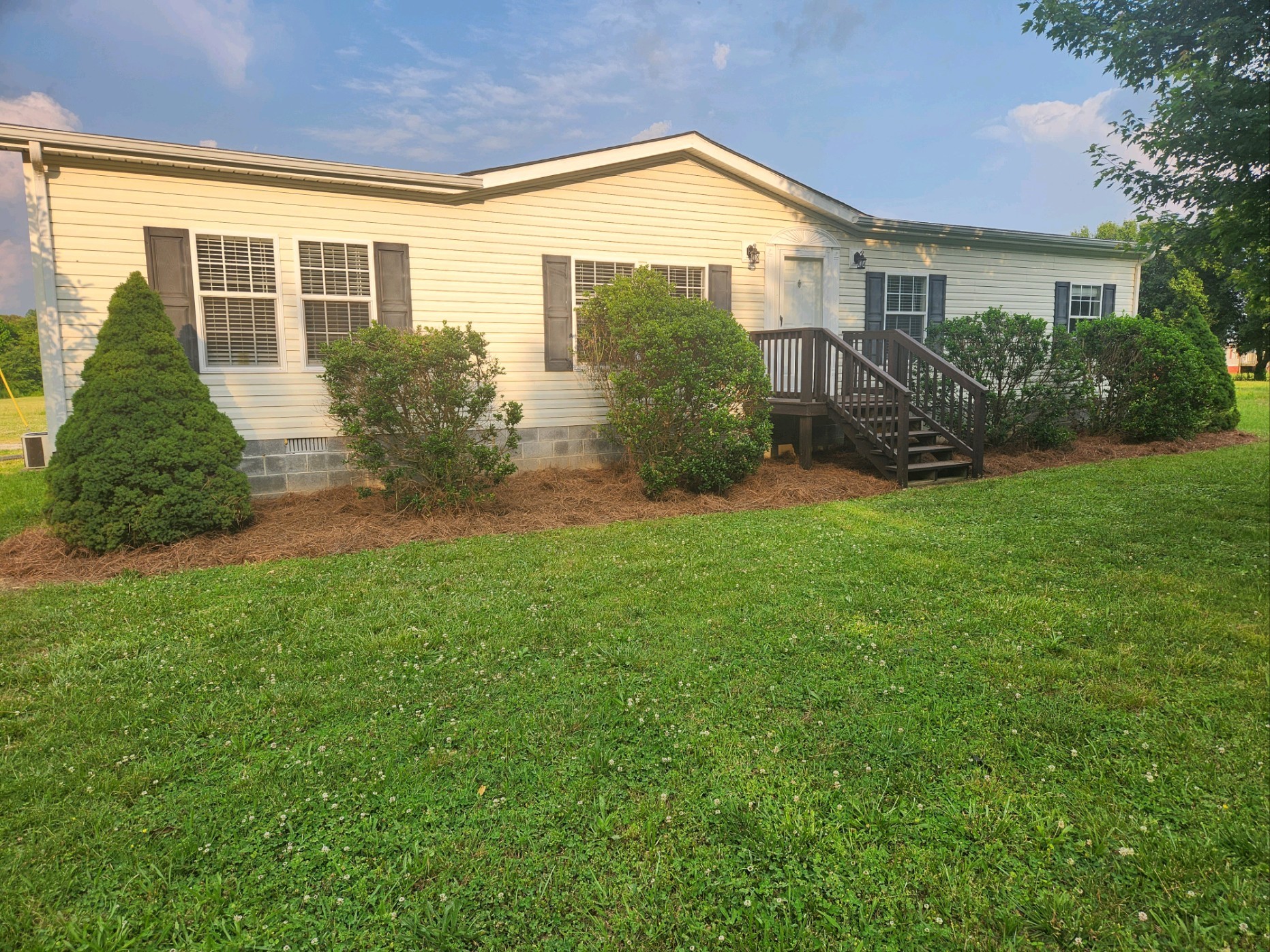1056 Caney Branch Road Morrison, TN 37357 - Photo 2 of 12 a front view of a house with a yard and plants