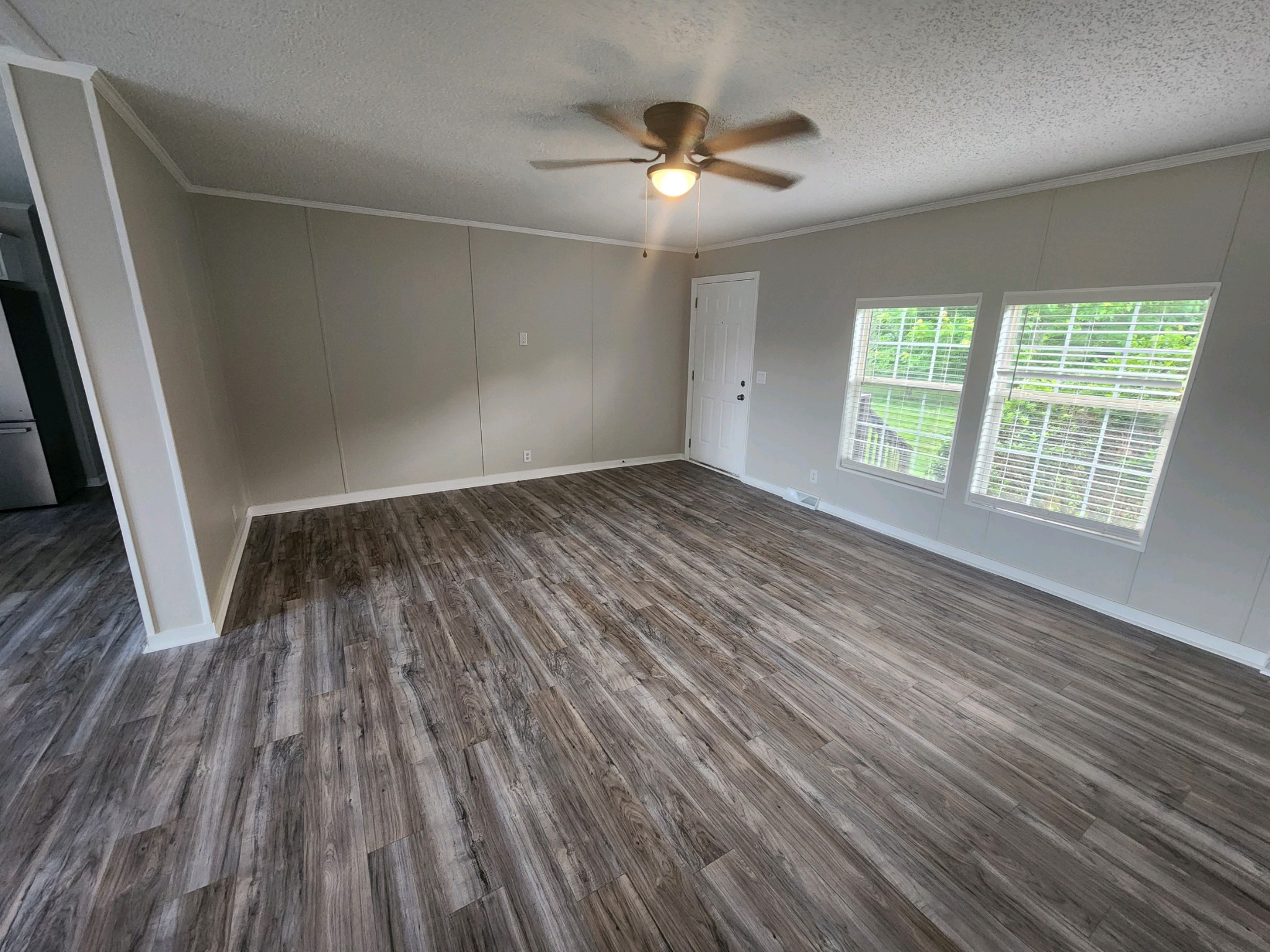 1056 Caney Branch Road Morrison, TN 37357 - Photo 3 of 12 an empty room with wooden floor and windows