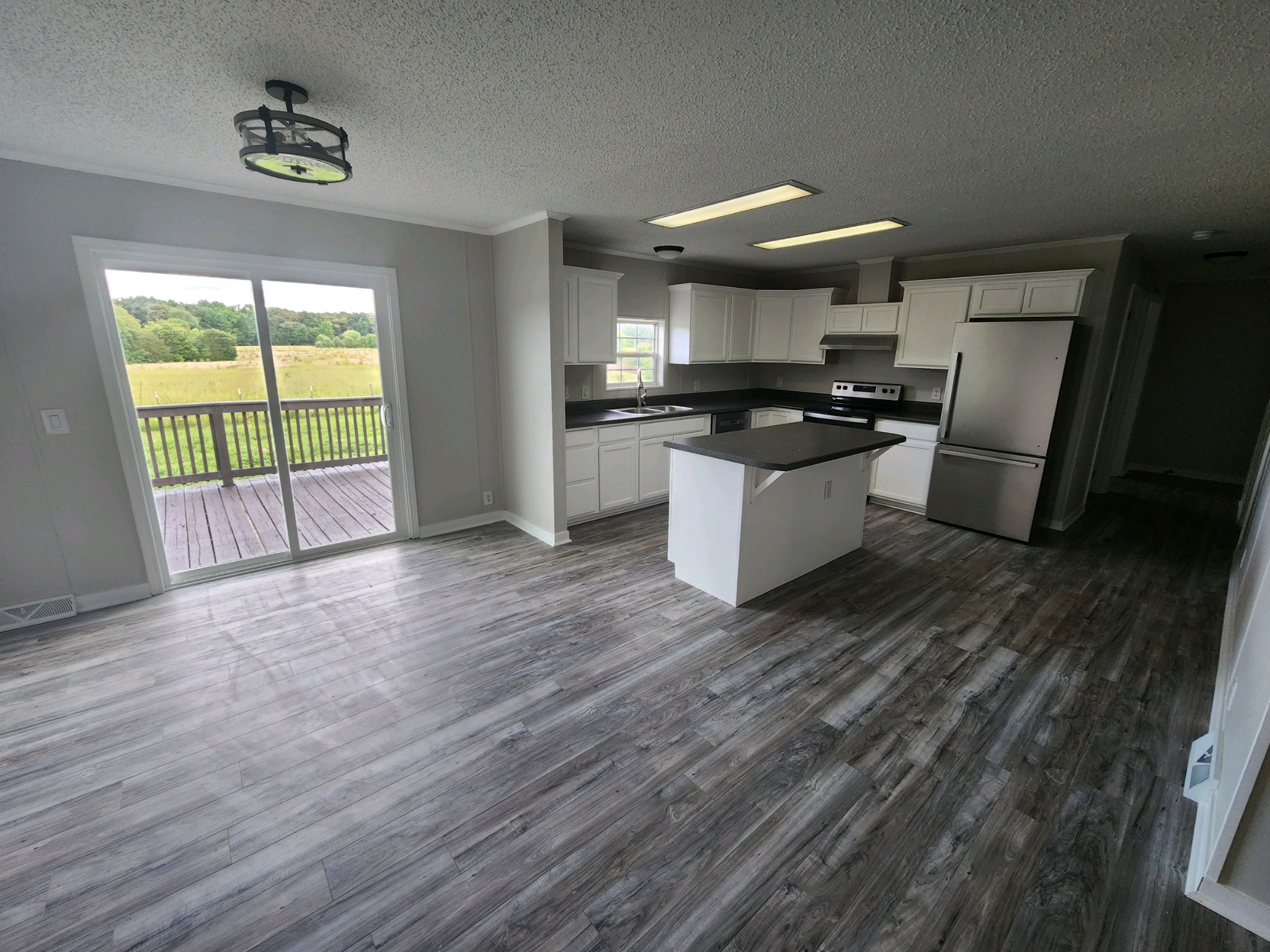 1056 Caney Branch Road Morrison, TN 37357 - Photo 4 of 12 a kitchen with granite countertop a stove and a refrigerator
