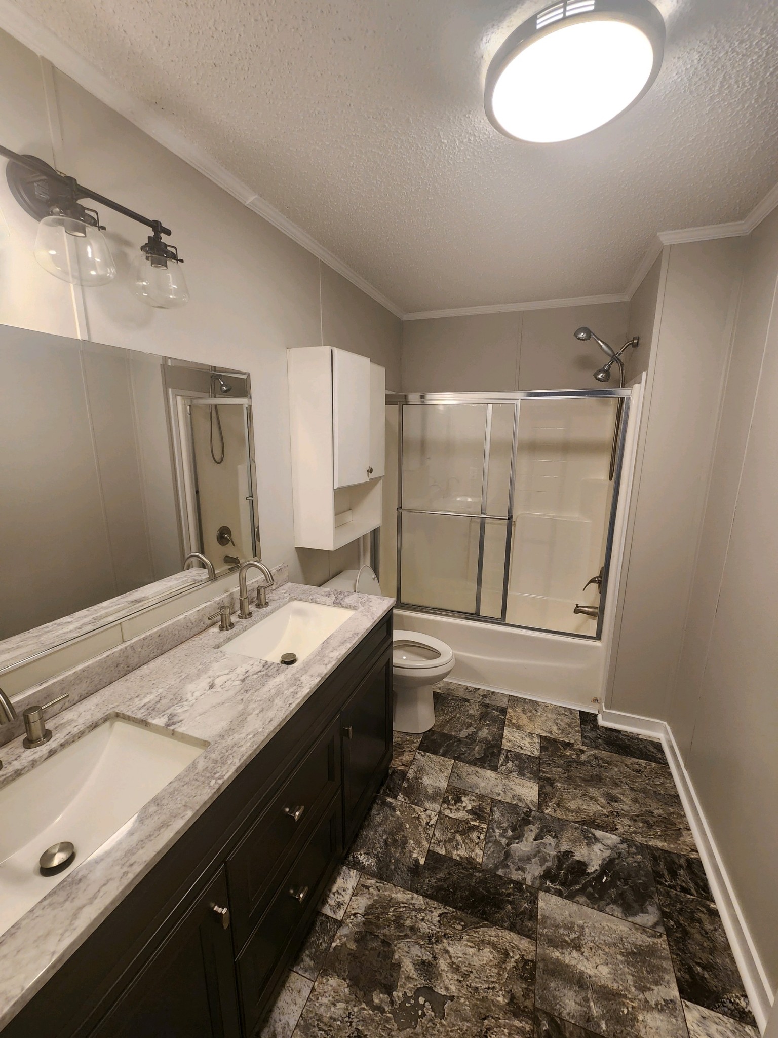 1056 Caney Branch Road Morrison, TN 37357 - Photo 9 of 12 a bathroom with a double vanity sink mirror and shower