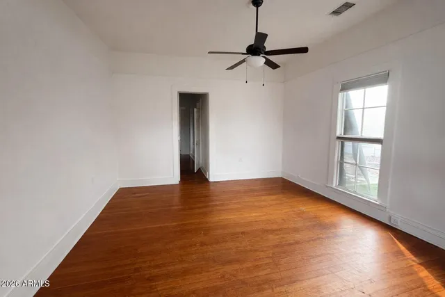 a view of an empty room with a window