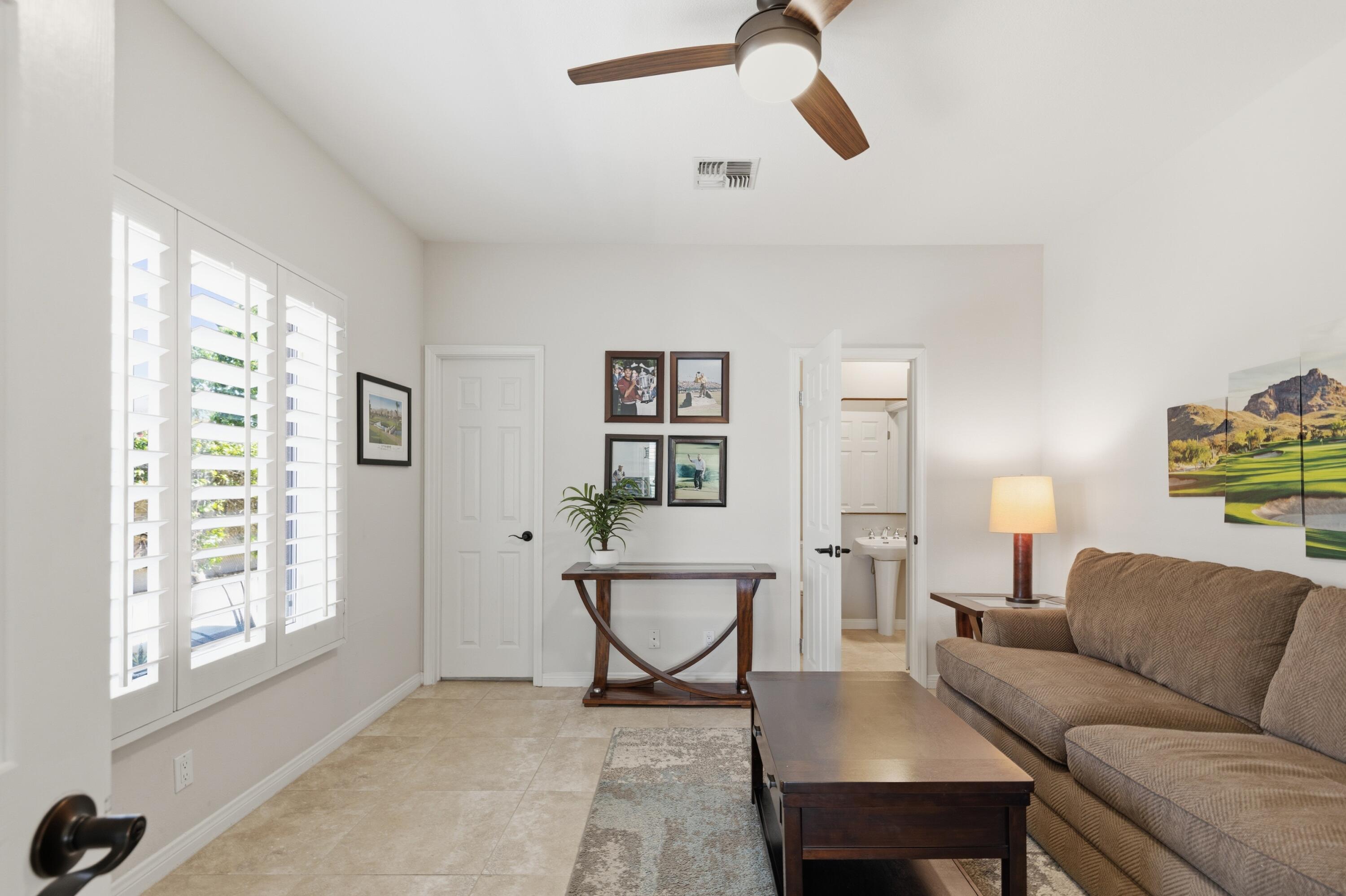 39 Augusta Drive Rancho Mirage, CA 92270 - Photo 22 of 53 a living room with furniture and a window