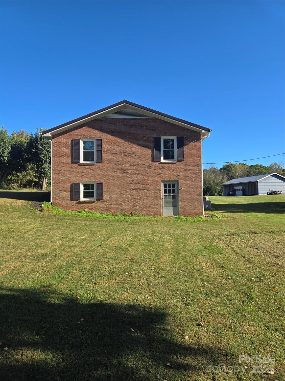 800 Andrew Mills Road Bostic, NC 28018 - Photo 3 of 19 a front view of a house with garden