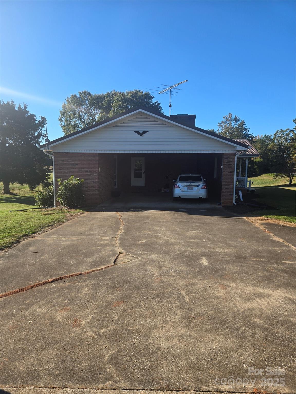 800 Andrew Mills Road Bostic, NC 28018 - Photo 5 of 19 a front view of a house with a yard and garage