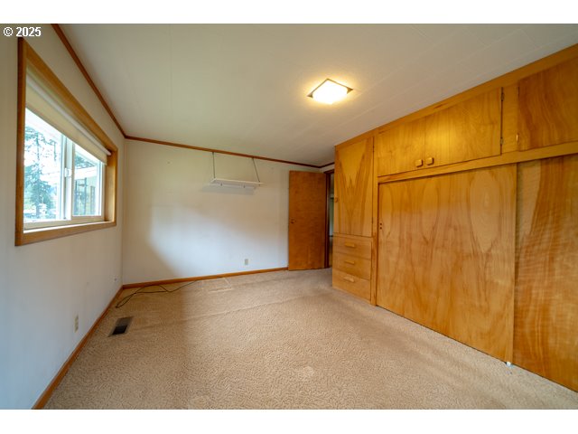 628 13th Street Lyons, OR 97358 - Photo 15 of 32 a view of an empty room with a window