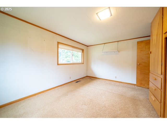 628 13th Street Lyons, OR 97358 - Photo 16 of 32 a view of an empty room with a window