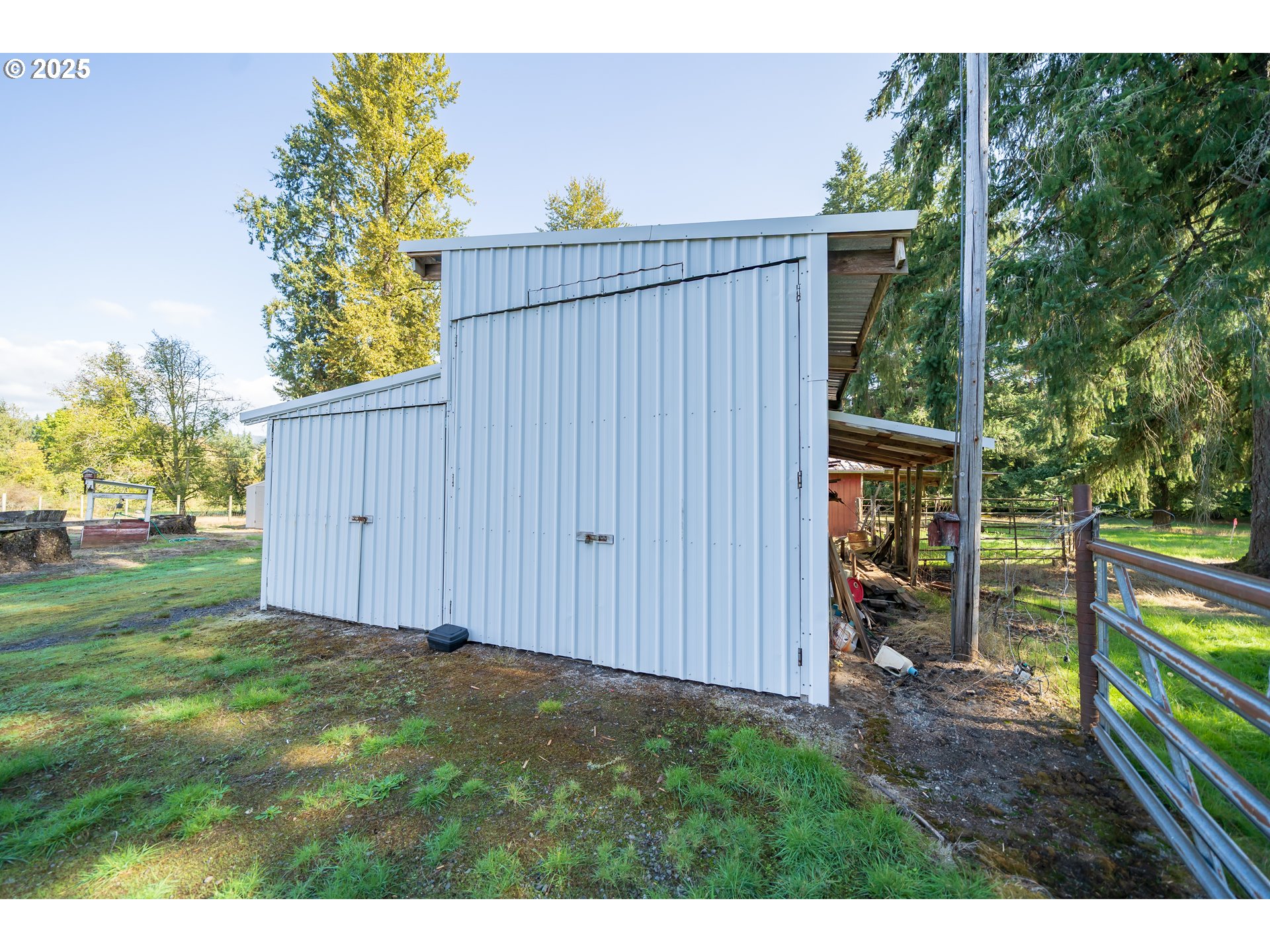 628 13th Street Lyons, OR 97358 - Photo 31 of 32 a view of a backyard with wooden fence and large trees