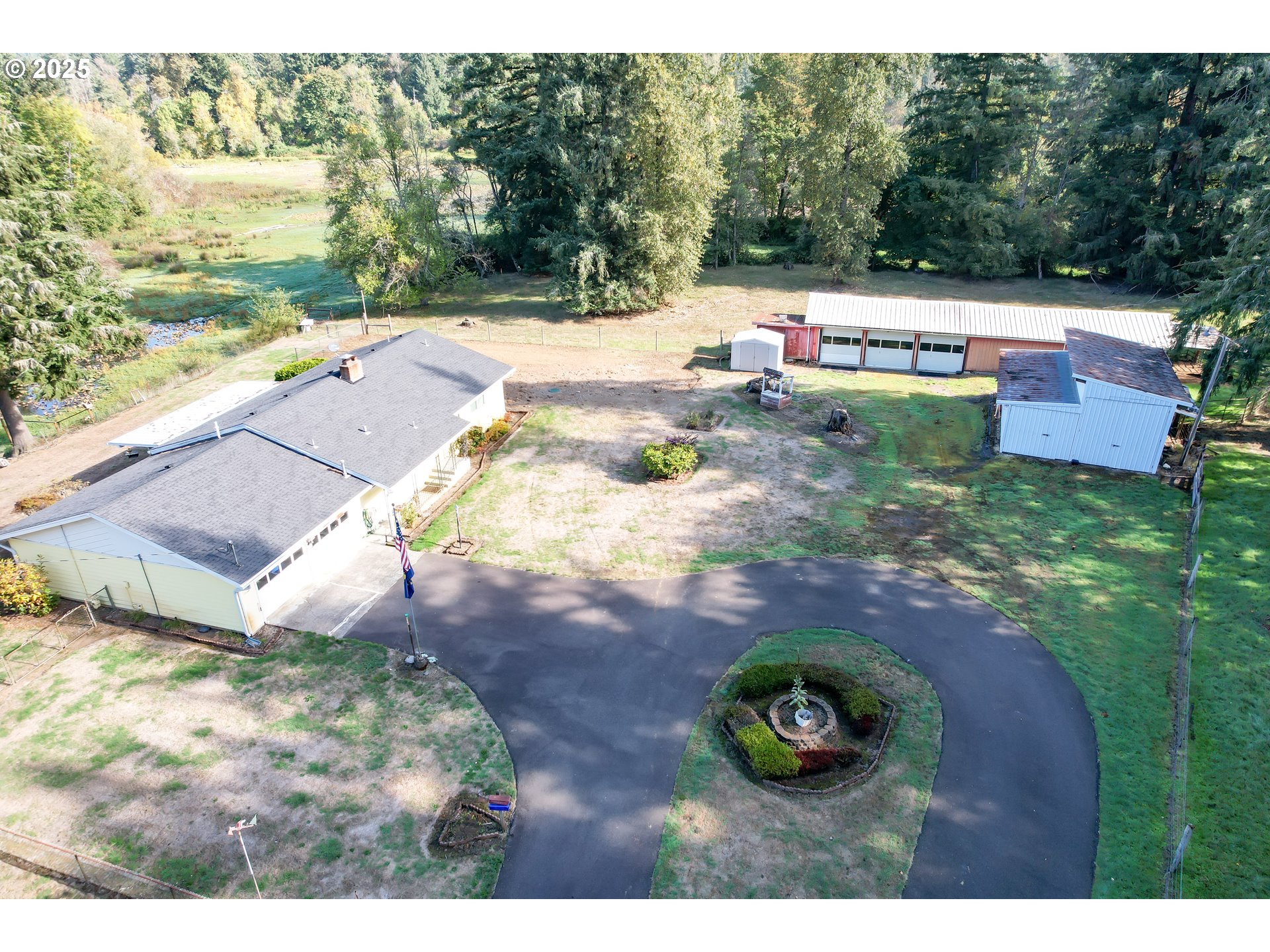 628 13th Street Lyons, OR 97358 - Photo 5 of 32 a backyard of a house with yard and outdoor seating