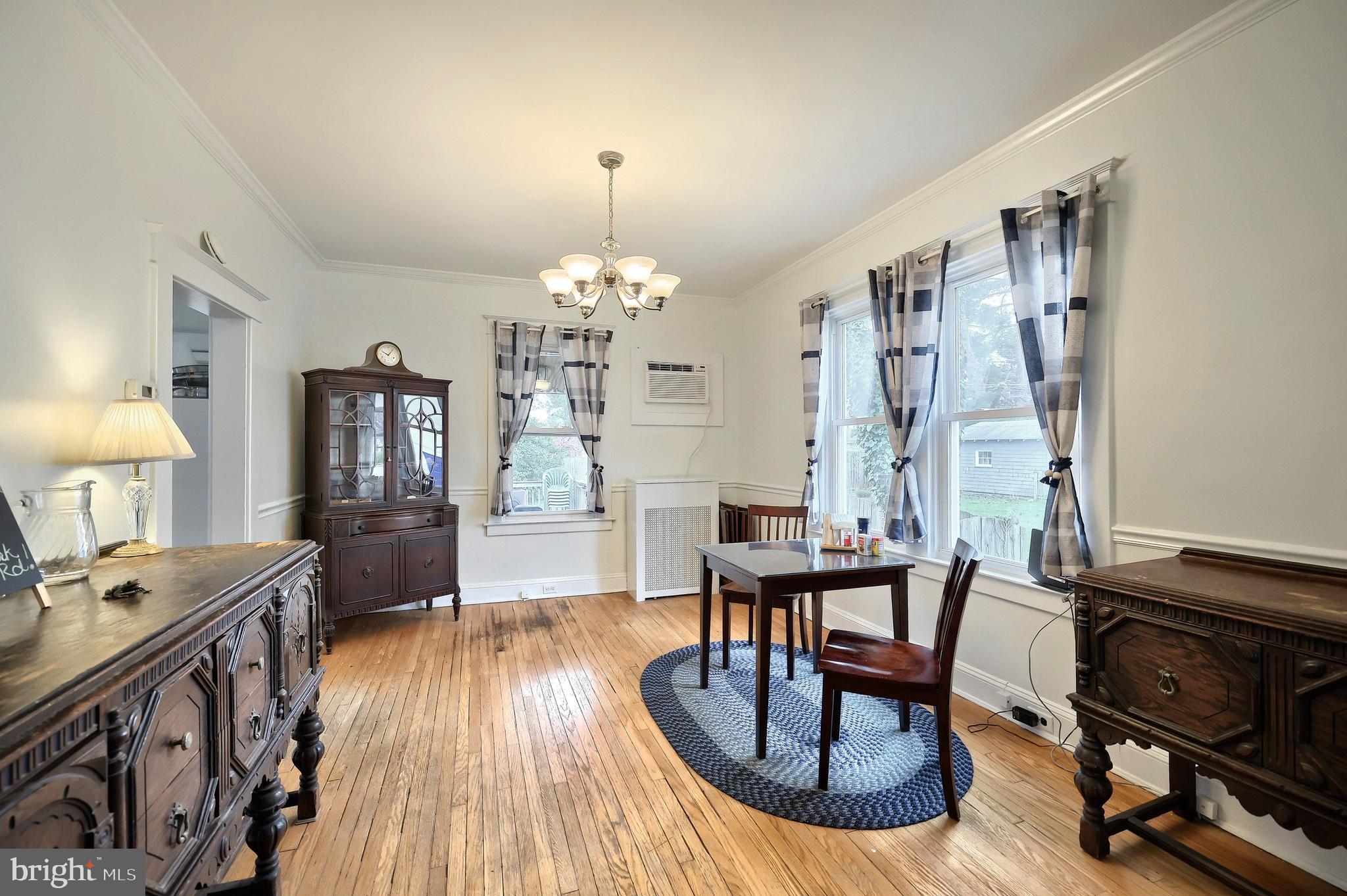 615 Dunkirk Road Baltimore, MD 21212 - Photo 11 of 45 a view of a dining room with furniture window and wooden floor
