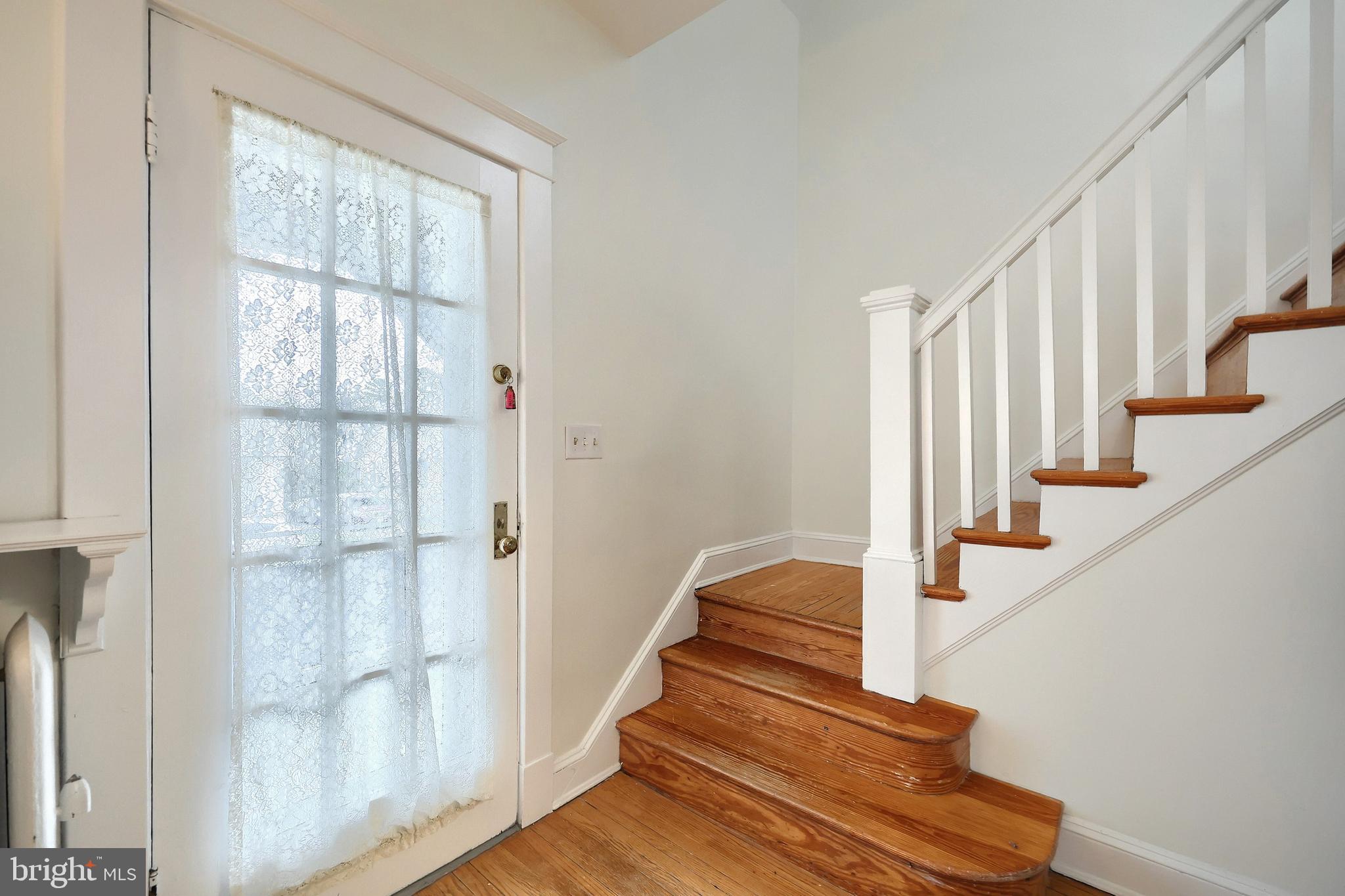 615 Dunkirk Road Baltimore, MD 21212 - Photo 16 of 45 a view of entryway and hall with wooden floor