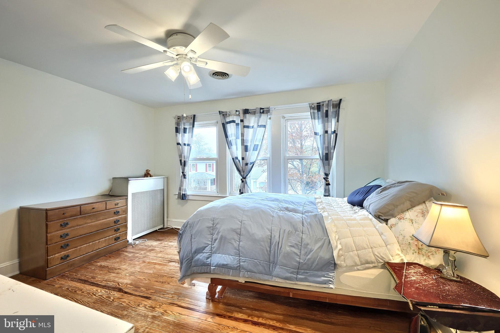 615 Dunkirk Road Baltimore, MD 21212 - Photo 19 of 45 a bedroom with a bed and window