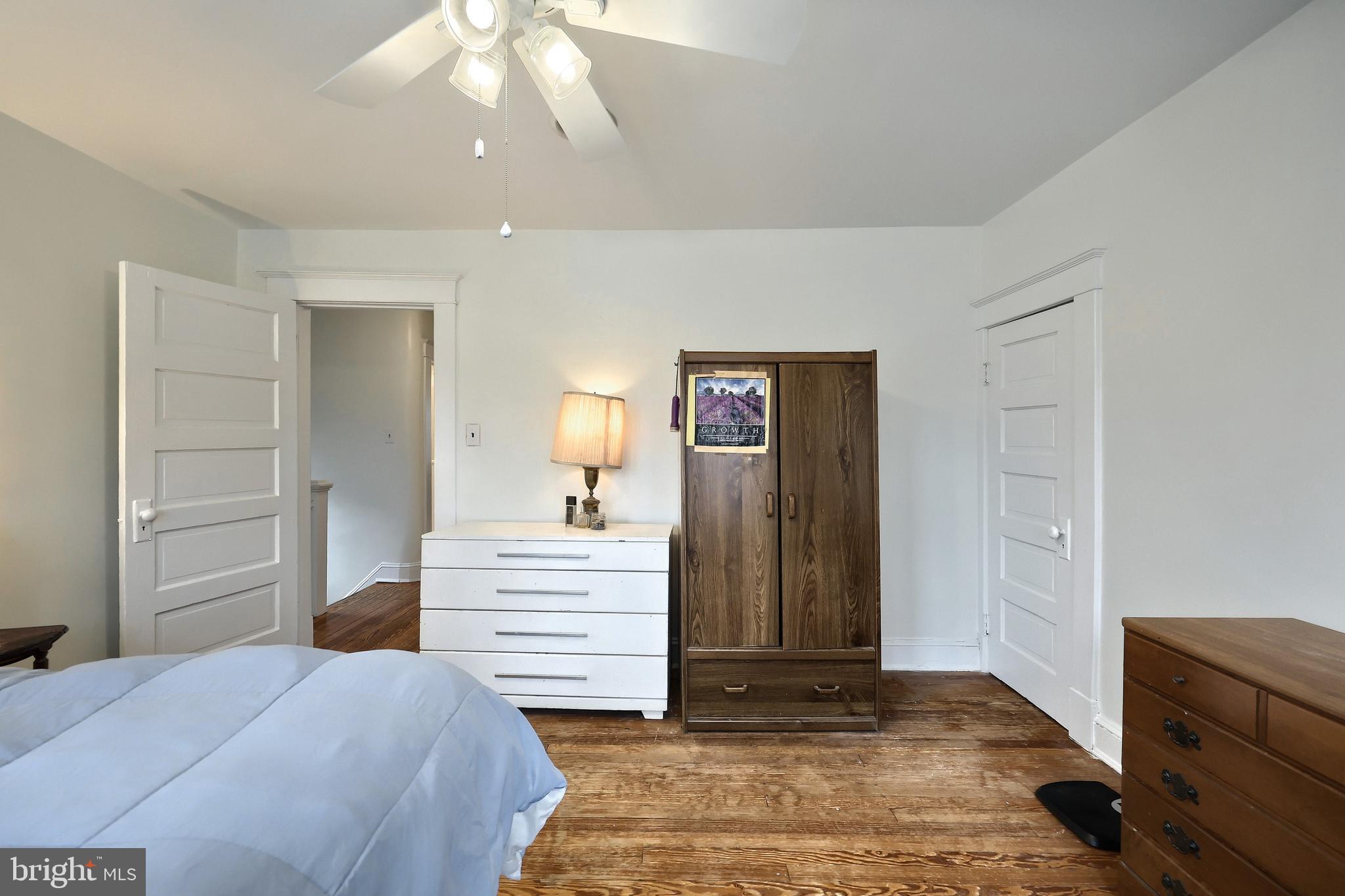 615 Dunkirk Road Baltimore, MD 21212 - Photo 20 of 45 a bedroom with a bed and a mirror