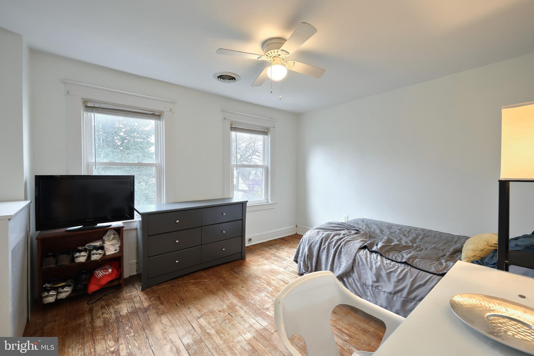 615 Dunkirk Road Baltimore, MD 21212 - Photo 22 of 45 a bedroom with a bed and a flat screen tv