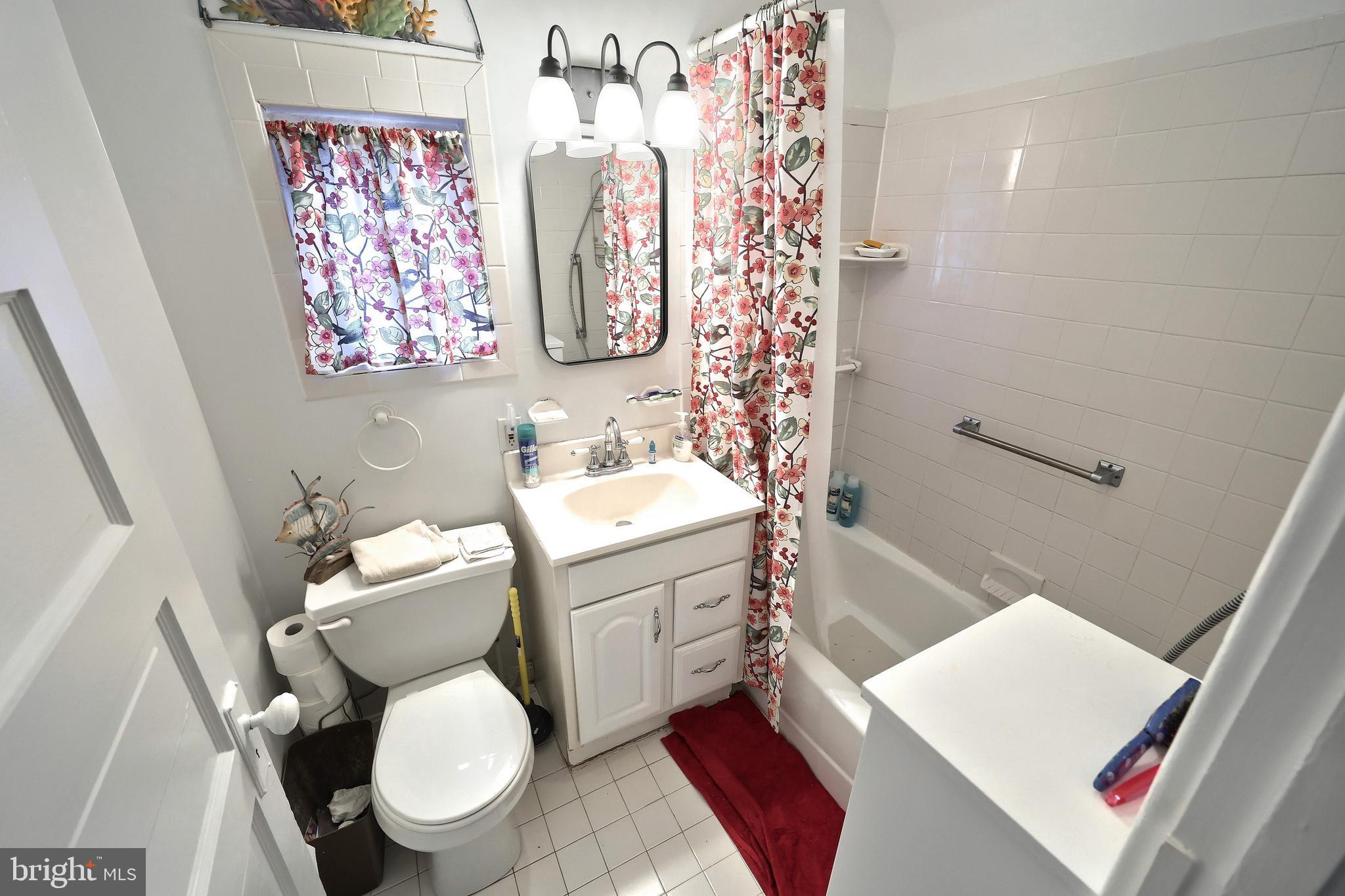 615 Dunkirk Road Baltimore, MD 21212 - Photo 24 of 45 a bathroom with a toilet a sink and a shower