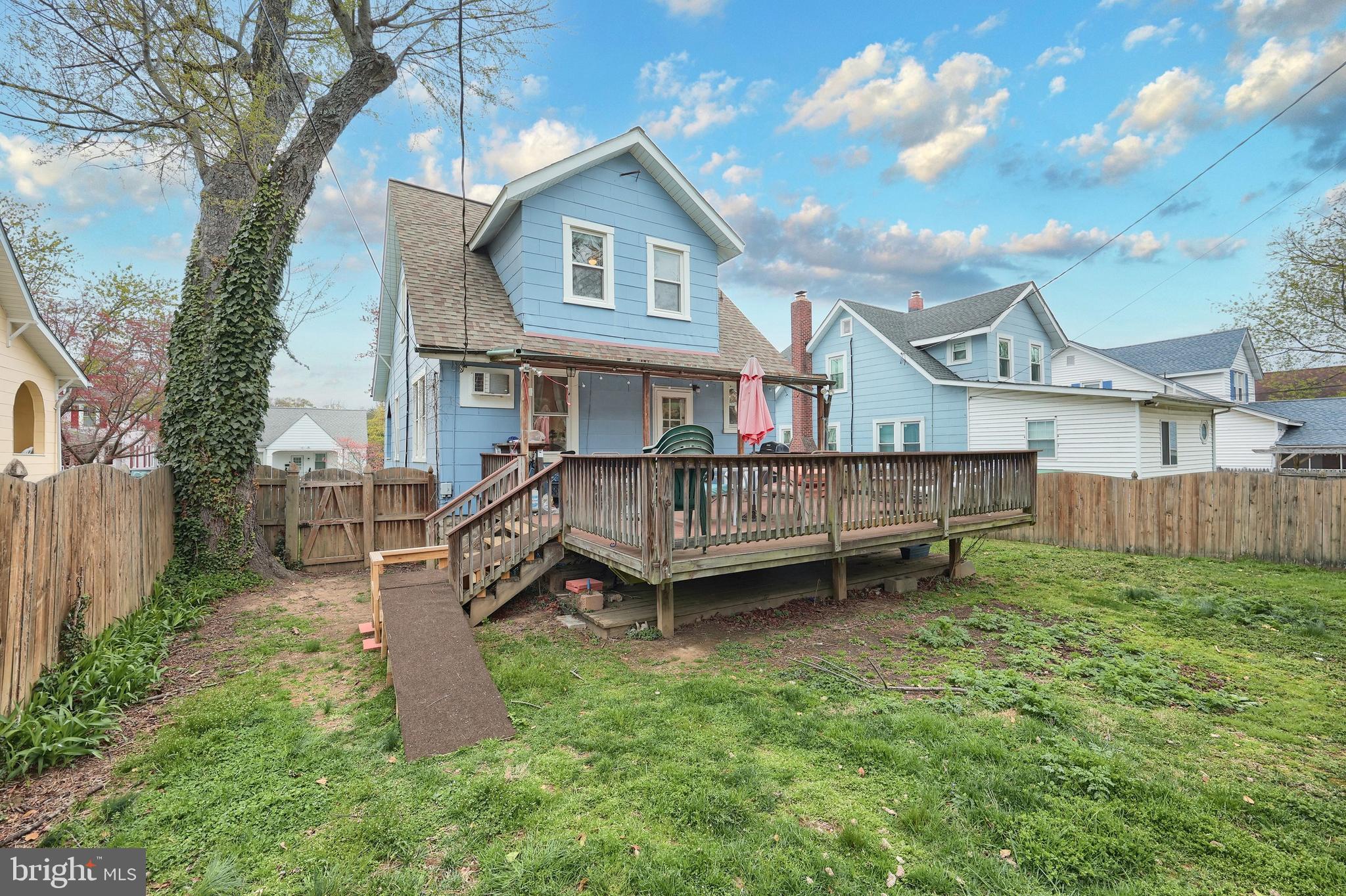 615 Dunkirk Road Baltimore, MD 21212 - Photo 28 of 45 a view of a house with a yard and a wooden deck