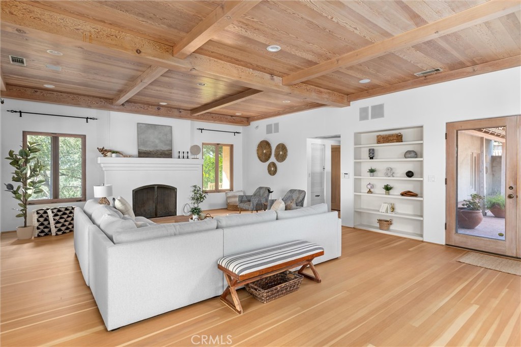 3595 West Oak Trail Road Santa Ynez, CA 93460 - Photo 12 of 60 a living room with furniture a fireplace and a flat screen tv