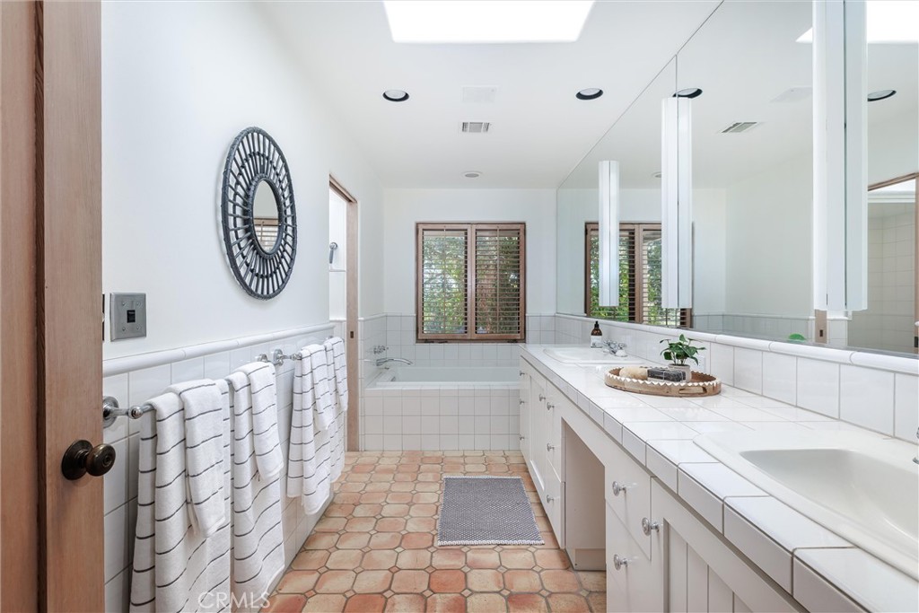3595 West Oak Trail Road Santa Ynez, CA 93460 - Photo 17 of 60 a spacious bathroom with a double vanity sink mirror and shower