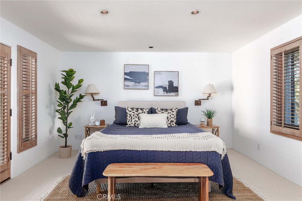 3595 West Oak Trail Road Santa Ynez, CA 93460 - Photo 20 of 60 a bedroom with a bed and a potted plant