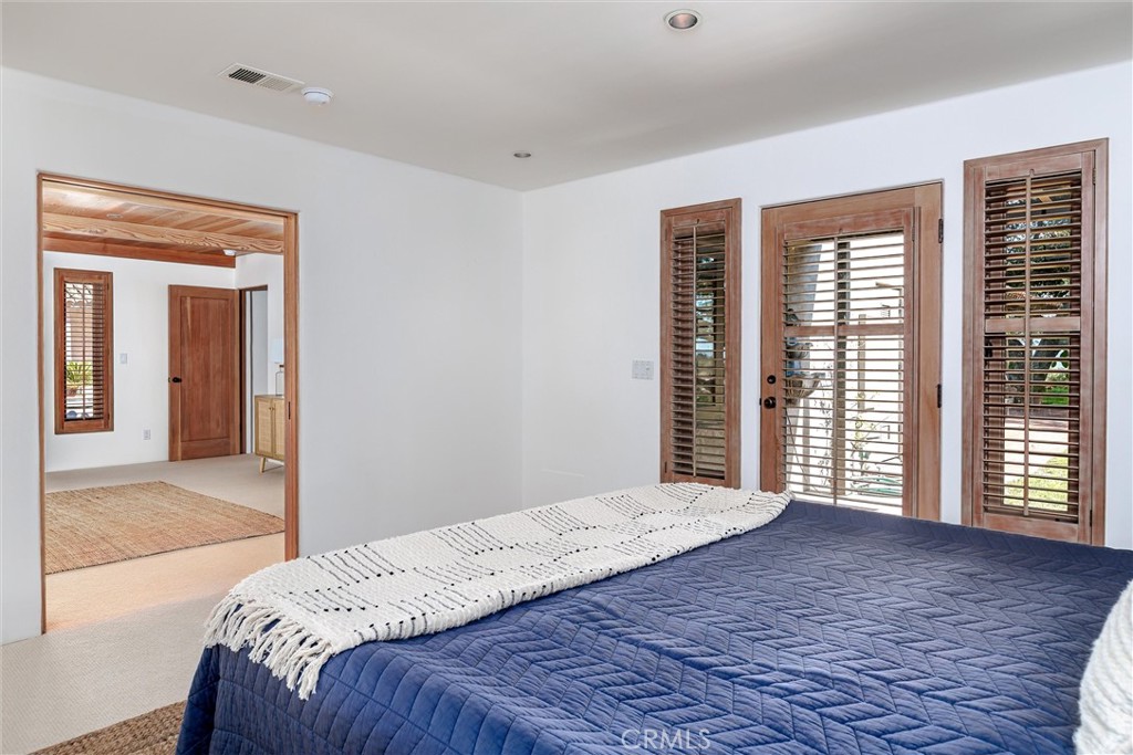3595 West Oak Trail Road Santa Ynez, CA 93460 - Photo 21 of 60 a bedroom with a large bed and a large window
