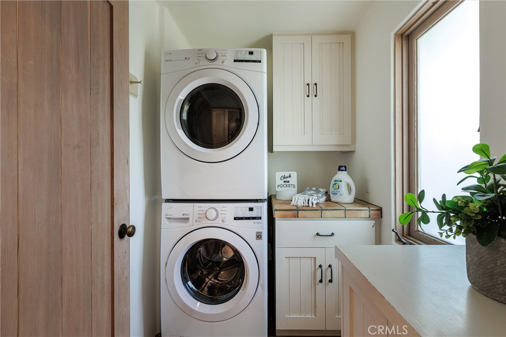 3595 West Oak Trail Road Santa Ynez, CA 93460 - Photo 22 of 60 a view of a hallway with washer and dryer
