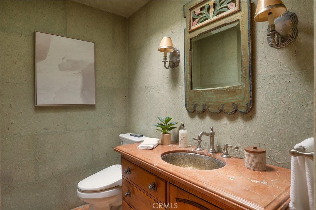 3595 West Oak Trail Road Santa Ynez, CA 93460 - Photo 23 of 60 a bathroom with a toilet sink and mirror