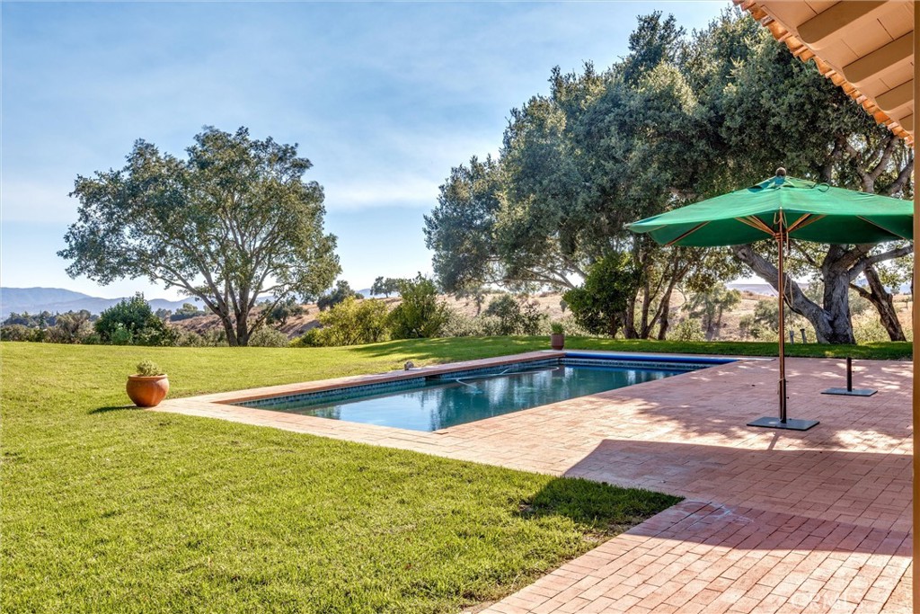 3595 West Oak Trail Road Santa Ynez, CA 93460 - Photo 39 of 60 a view of a swimming pool with a patio