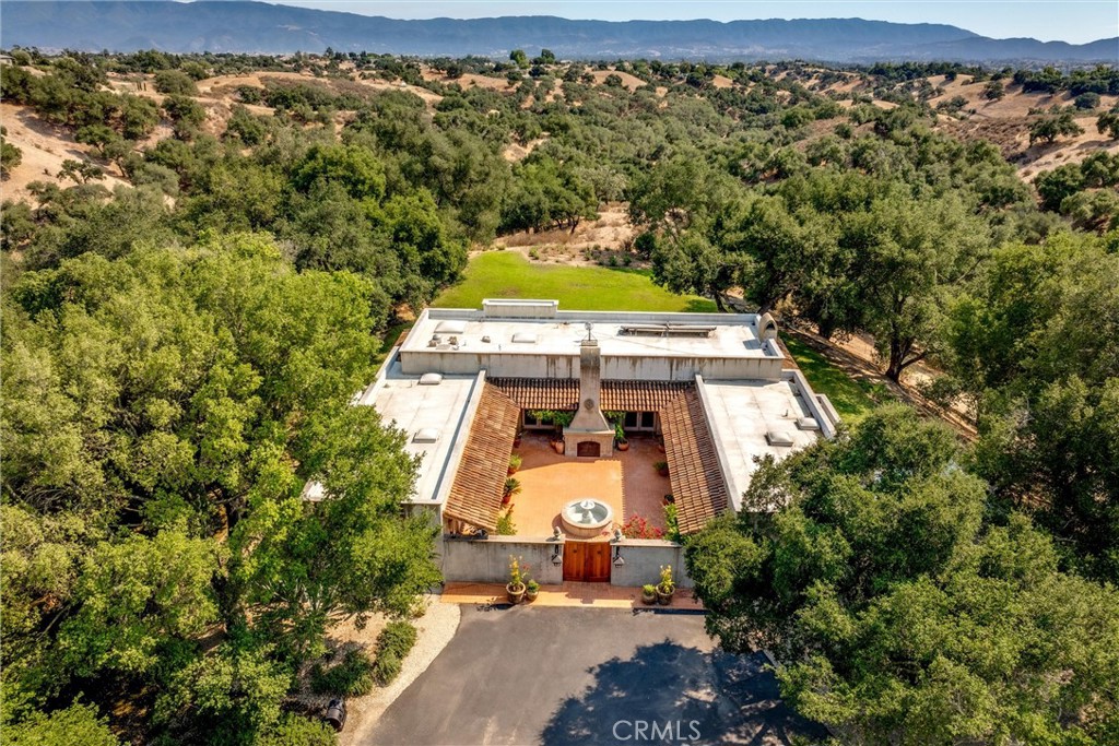 3595 West Oak Trail Road Santa Ynez, CA 93460 - Photo 53 of 60 an aerial view of a house with a yard swimming pool and mountain view