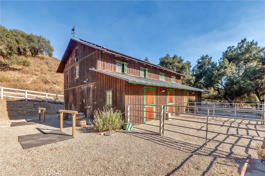 3595 West Oak Trail Road Santa Ynez, CA 93460 - Photo 55 of 60 a backyard of a house with table and chairs