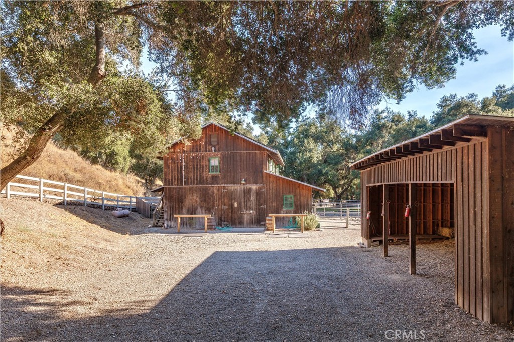 3595 West Oak Trail Road Santa Ynez, CA 93460 - Photo 57 of 60 a view of a house with a yard and large tree